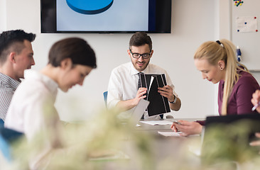 Image showing young business people group on team meeting at modern office