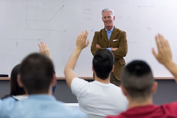 Image showing teacher with a group of students in classroom