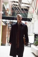 Image showing handsome senior business man walking