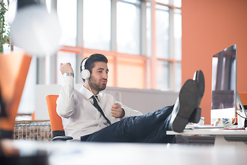 Image showing relaxed young business man at office