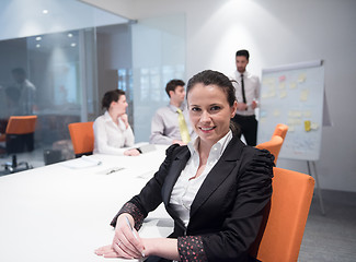 Image showing young business woman on meeting  using laptop computer