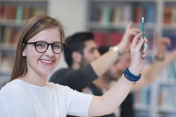 Image showing group of students  raise hands up