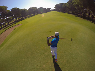 Image showing top view of golf player hitting shot