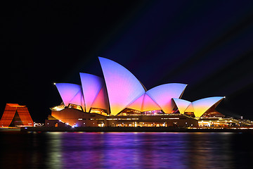 Image showing Sunrise colours on the Sydney Opera House, Vivid 2016