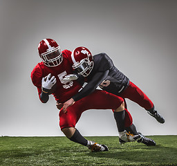 Image showing The two american football players in action