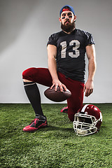 Image showing The american football player with ball