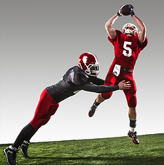 Image showing The two american football players in action