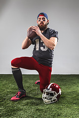 Image showing The american football player with ball