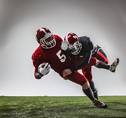 Image showing The two american football players in action