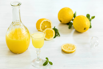 Image showing Italian traditional liqueur limoncello with lemon