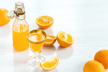 Image showing Glass of orange liqueur. Selective focus