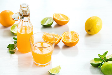 Image showing Glass of orange liqueur. Selective focus