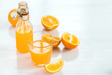 Image showing Glass of orange liqueur. Selective focus