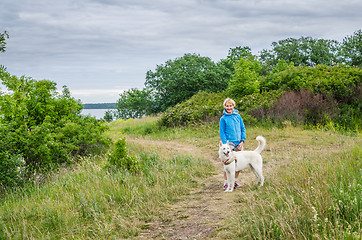 Image showing woman with a dog on the beach