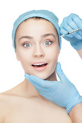 Image showing Attractive woman at plastic surgery with syringe in her face