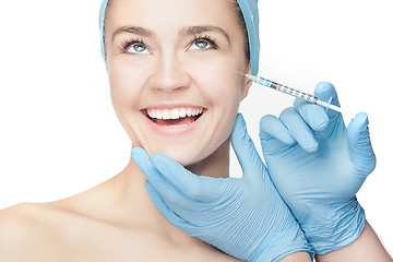 Image showing Attractive woman at plastic surgery with syringe in her face