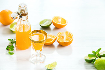 Image showing Glass of orange liqueur. Selective focus