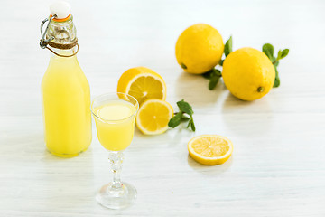 Image showing Italian traditional liqueur limoncello with lemon
