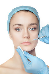 Image showing Attractive woman at plastic surgery with syringe in her face