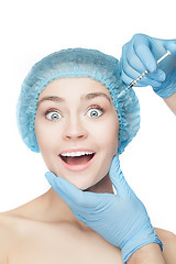 Image showing Attractive woman at plastic surgery with syringe in her face