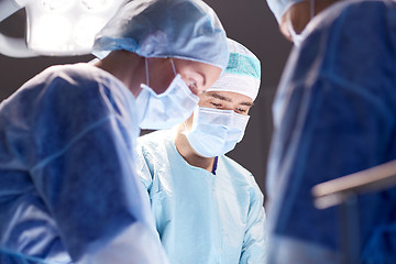 Image showing group of surgeons in operating room at hospital