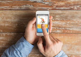 Image showing male hand with smartphone and sports application