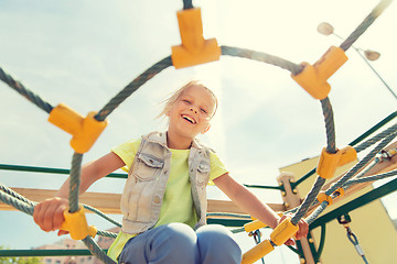 Image showing happy little girl climbing on children playground