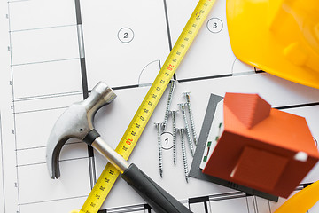 Image showing close up of house blueprint with building tools