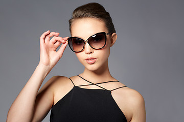 Image showing beautiful young woman in elegant black sunglasses