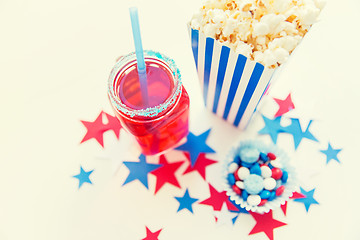 Image showing drink and popcorn with candies on independence day