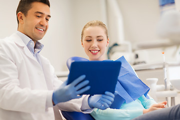 Image showing male dentist with tablet pc and woman patient