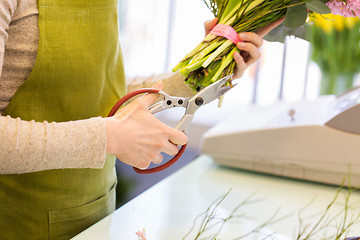 Image showing close up of florist making bunch at flower shop