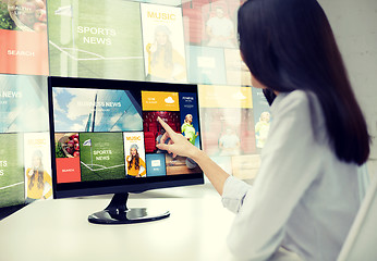 Image showing close up of woman with news on computer in office