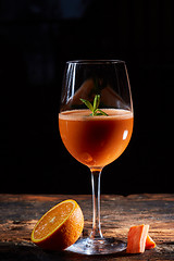 Image showing Orange carrot smoothie in glass decorated mint