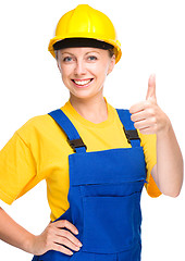 Image showing Young construction worker is showing thumb up sign