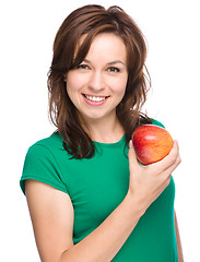 Image showing Young happy girl with apple