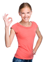 Image showing Young teen girl is showing OK sign