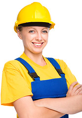 Image showing Young happy lady as a construction worker