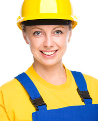 Image showing Young happy lady as a construction worker