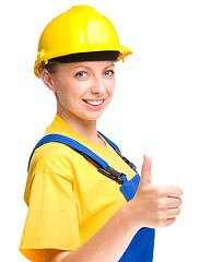 Image showing Young construction worker is showing thumb up sign