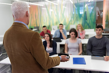 Image showing teacher with a group of students in classroom