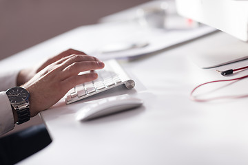 Image showing hands typing on desktop computer