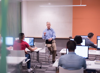 Image showing teacher and students in computer lab classroom