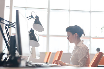 Image showing business woman working on computer at office