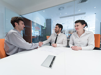 Image showing young couple signing contract documents on partners back