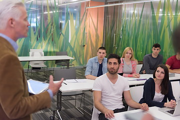 Image showing teacher with a group of hi school students in classroom