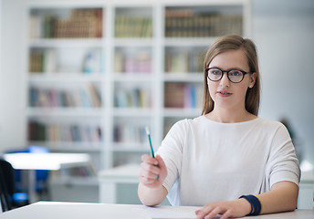 Image showing female student study in school library