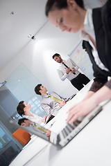 Image showing young business woman on meeting  using laptop computer