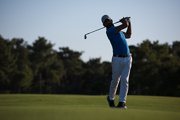 Image showing golfer hitting long shot