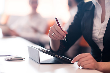 Image showing woman hands holding pen on business meeting